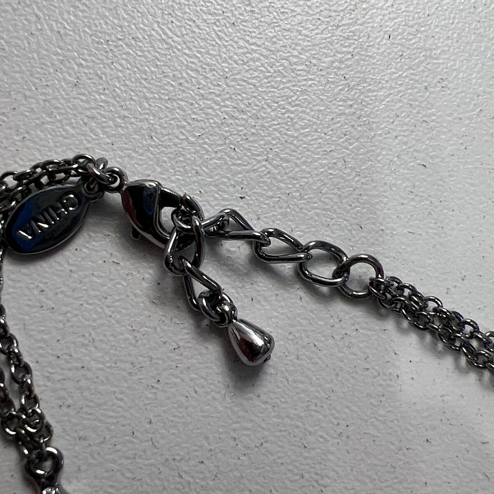 JTV JOAN BOYCE, GUNMETAL TONE
WITH WHITE CRYSTAL EVIL EYE
STATION BRACELET - Picture 6 of 7